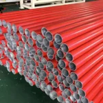 Red-painted fence posts
