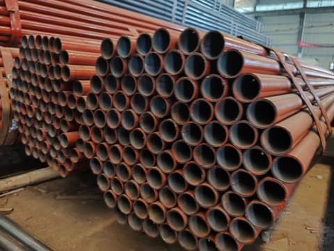 Red-painted scaffolding pipes for construction